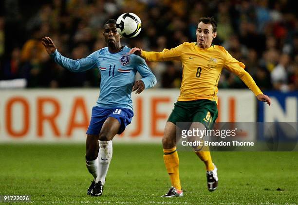 Eljero Elia of the Netherlands competes with Luke Wilkshire of Australia during the international friendly match between Australia and the...