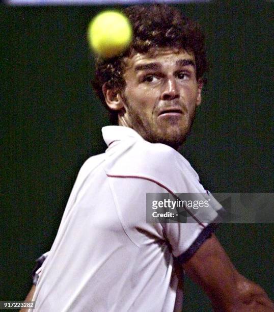 Tennis player Gustavo Kuerten of Brazil returns the ball to Czech Jiri Vanek during their match at the AT&T Cup in Buenos Aires, Argentina 22...