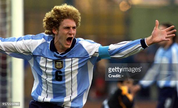 Argentine player Fabricio Coloccini, who scored the third goal of his team against Egypt, celebrates, 20 June 2001, during their Group A game for the...
