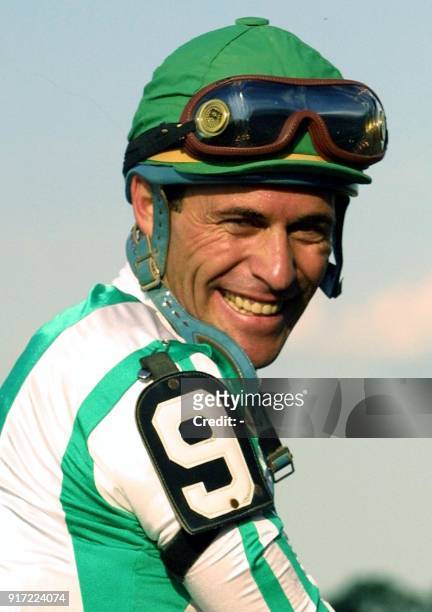 Jockey Gary Stevens smiles as he heads towards winner's circle after winning the 133rd running of the Belmont Stakes aboard Point Given 09 June 2001...