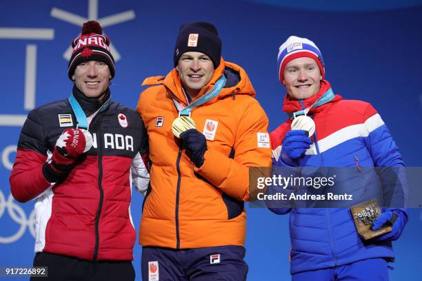 Silver medalist Ted-Jan Bloemen of Canada, gold medalist Sven Kramer of the Netherlands and bronze medalist Sverre Lunde Pedersen of Norway pose...