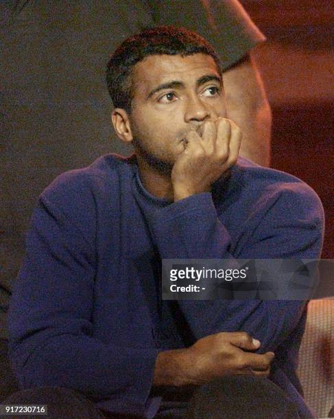 Brazilian soccer star Romario of the team Vasco da Gama watches from the stands as his team plays Deportivo Concepcion de Chile in the Copa...