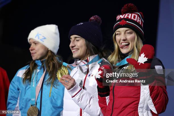 Bronze medalist Yulia Galysheva of Kazakhstan, gold medalist Perrine Laffont of France and Silver medalist Justine Dufour-Lapointe of Canada pose...