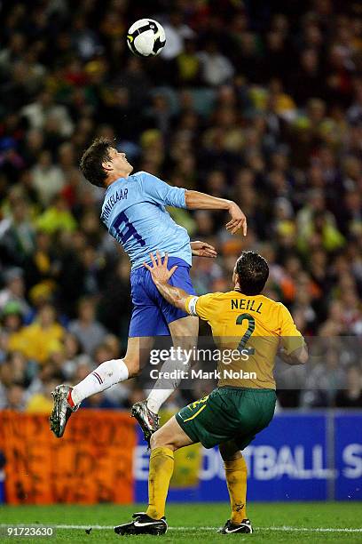 Klaas Jan Huntelaar of the Netherlands and Lucas Neill of the Socceroos contest possesion during the International friendly football match between...