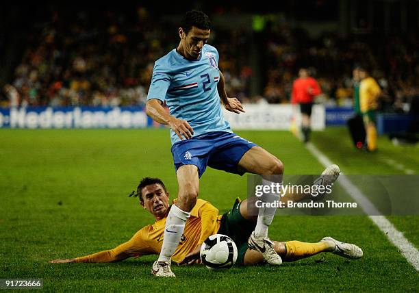 Khalid Boulahrouz of the Netherlands competes with Harry Kewell of Australia during the international friendly match between Australia and the...