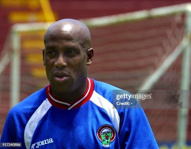 Costa Rican player Hernan Medford watches his teammates, 19 June 2001, after practice at the Alejandro Morera Soto Stadium, in Alajuela, Costa Rica....