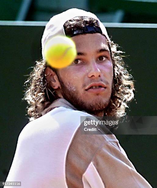 Argentinian Jose Acasuso watches the ball before returning it to Albert Portas of Spain during their match at the AT&T Cup in Buenos Aires on 21...