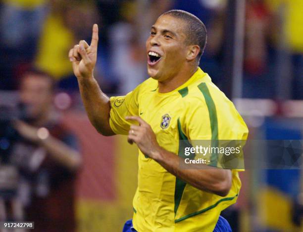 Brazilian forward Ronaldo celebrates after scoring the second goal for his side during the second round match Brazil/Belgium of the 2002 FIFA World...