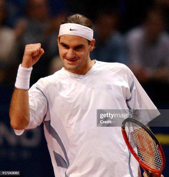 Swiss Roger Federer celebrates winning his match against German Alexander Waske at the Davidoff Swiss Indoors in Basel, Switzerland, 24 October 2002....