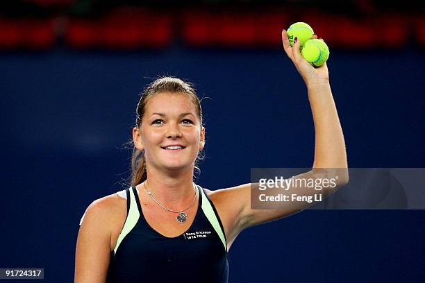 Agnieszka Radwanska of Poland celebrates winning against Marion Bartoli of France in the Semifinals during day nine of the 2009 China Open at the...