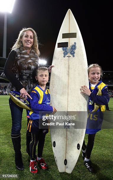 Rani Mainwaring , Zac Mainwaring and Maddy Mainwaring hold "Mainy's Board" which was presented to the winning team during the Chris Mainwaring...