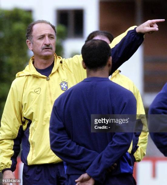 Head coach of the Brazilian soccer team, Luis Felipe Scolari gives instructions to Romario, during a training session in Teresopolis, Brazil, 21 June...