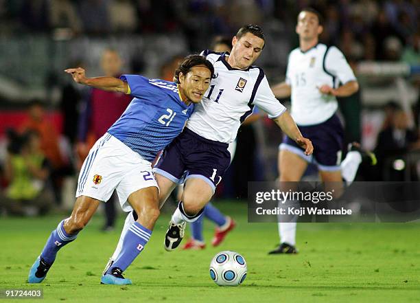 Craig Conway of Scotland and Naohiro Ishikawa of Japan compete for the ball during Kirin Challenge Cup 2009 match between Japan and Scotland at...