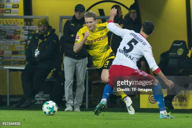 Andre Schuerrle of Dortmund and Mergim Mavraj of Hamburg battle for the ball during the Bundesliga match between Borussia Dortmund and Hamburger SV...