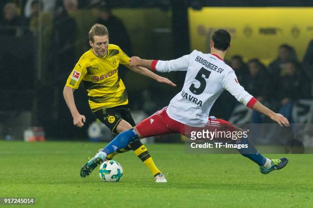 Andre Schuerrle of Dortmund and Mergim Mavraj of Hamburg battle for the ball during the Bundesliga match between Borussia Dortmund and Hamburger SV...