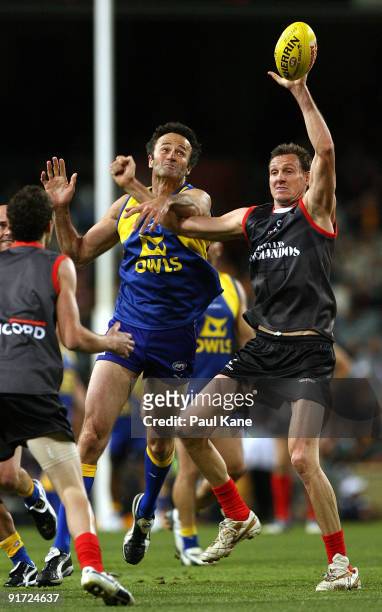 Daniel Bandy wins the ruck against Laurie Keene during the Chris Mainwaring charity AFL match at Subiaco Oval on October 10, 2009 in Perth, Australia.
