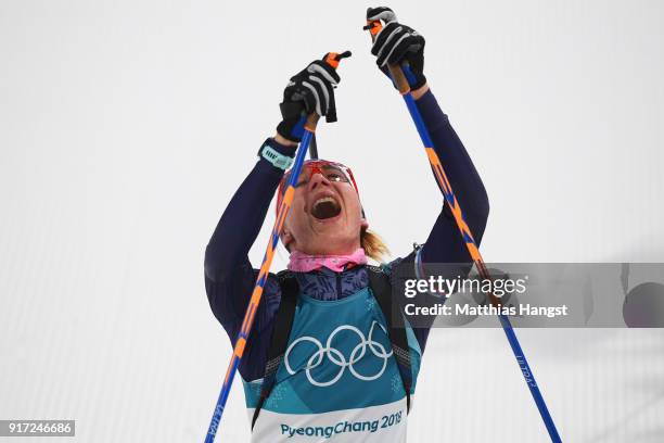 Anastasiya Kuzmina of Slovakia celebrates her time after crossing the finish line during the Women's Biathlon 10km Pursuit on day three of the...