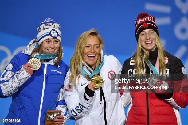 Finland's bronze medallist Enni Rukajarvi, USA's gold medallist Jamie Anderson and Canada's silver medallist Laurie Blouin pose on the podium during...