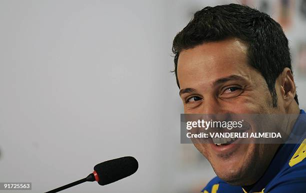 Brazilian goalkeeper Julio Cesar smiles during a press conference before a training session of the national football team on October 10 in...