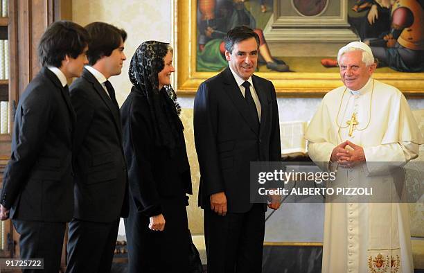 Pope Benedict XVI poses next to French prime minister Francois Fillon and his wife Penelope and their sons Antoine and Edouard during a private...