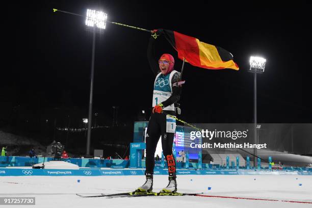 Laura Dahlmeier of Germany celebrates her time after crossing the finish line during the Women's Biathlon 10km Pursuit on day three of the...