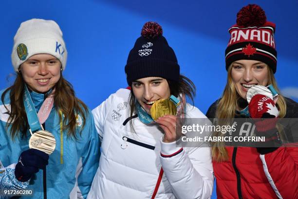 Canada's silver medallist Justine Dufour-Lapointe, France's gold medallist Perrine Laffont and Kazakhstan's bronze medallist Yulia Galysheva pose on...