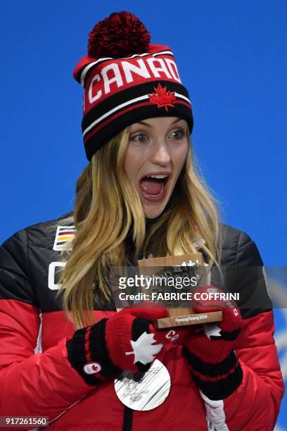 Canada's silver medallist Justine Dufour-Lapointe reacts on the podium during the medal ceremony for the women's freestyle skiing moguls at the...