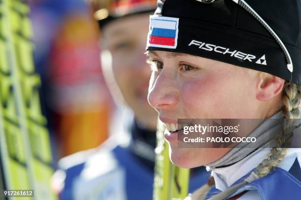 Russia's Julia Tchepalova smiles in the finish area after winning the World Cup women's 4x5km relay cross country race in Tesero 12 December 2004....