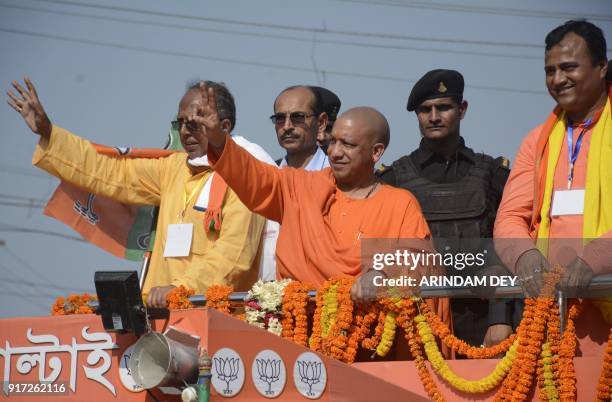 Chief minister of Uttar Pradesh, Yogi Adityanath gestures towards a crowd during a political rally ahead of a legislative assembly election at...