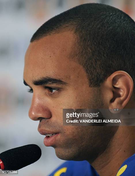 Brazilian footballer Diego Tardelli speaks during a press conference before a training session of the national team on October 10 in Teresopolis,...