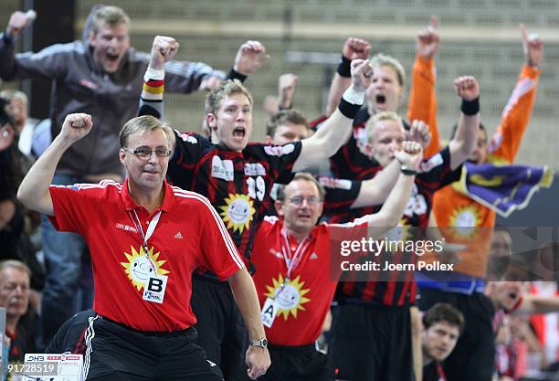 Head coach Patrik Liljestrand ) of Luebbecke and his team celebrates after the Handball Bundesliga match between TuS-N-Luebbecke and SG...