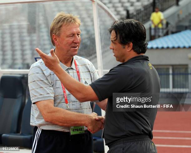 Germany coach Horst Hrubesch meets up with Brazil coach Rogerio before the FIFA U20 World Cup Quarter Final match between Brazil and Germany at the...