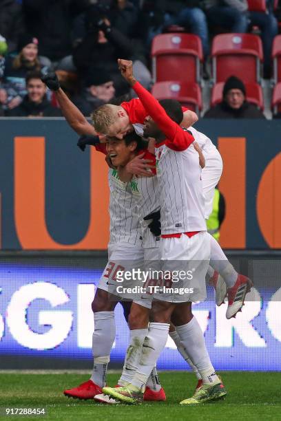 Ja-Cheol Koo of Augsburg celebrates after scoring his team`s first goal with Francisco da Silva Caiuby of Augsburg, Martin Hinteregger of Augsburg...