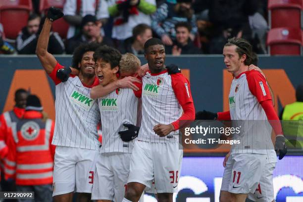 Ja-Cheol Koo of Augsburg celebrates after scoring his team`s first goal with Francisco da Silva Caiuby of Augsburg, Martin Hinteregger of Augsburg...