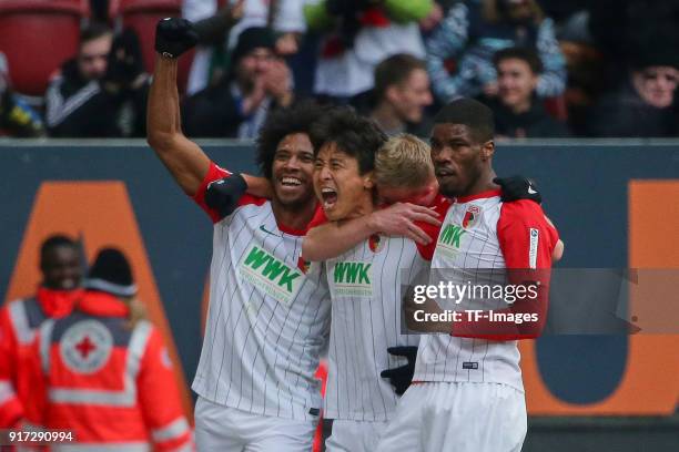 Ja-Cheol Koo of Augsburg celebrates after scoring his team`s first goal with Francisco da Silva Caiuby of Augsburg, Martin Hinteregger of Augsburg...