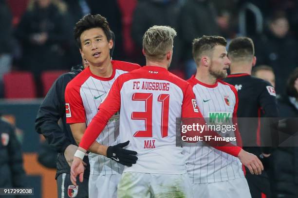 Ja-Cheol Koo of Augsburg and Philipp Max of Augsburg celebrate after winning the Bundesliga match between FC Augsburg and Eintracht Frankfurt at...