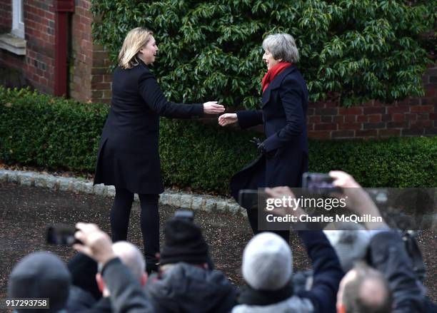 Prime Minister Theresa May is greeted by Northern Ireland Secretary of State Karen Bradley as she arrives at Stormont House on February 12, 2018 in...