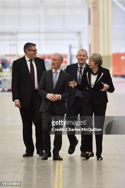 British Prime Minister Theresa May speaks to Michael Ryan , president of Bombardier Aerostructures and Engineering services division, during a visit...