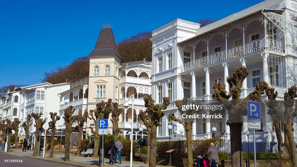 Sellin, island Rugen - street with white wooden historic buildings for rent in holiday