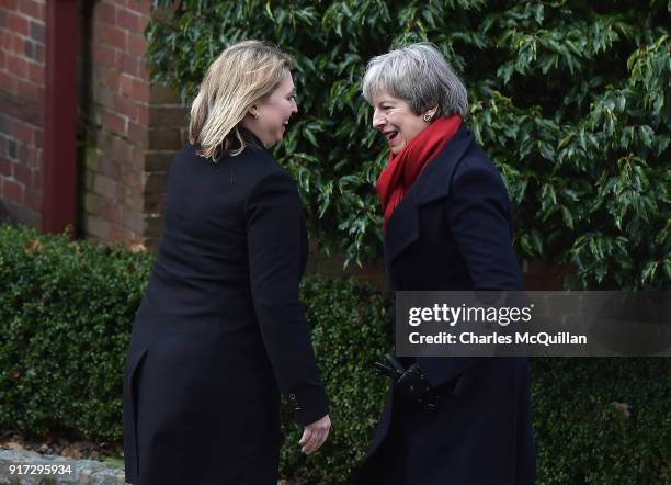 Prime Minister Theresa May is greeted by Northern Ireland Secretary of State Karen Bradley as she arrives at Stormont House on February 12, 2018 in...