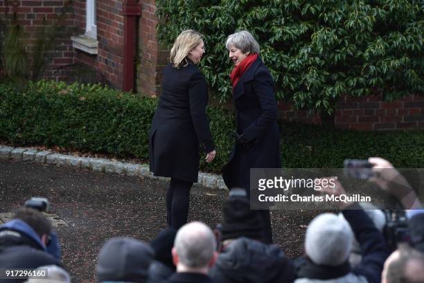 Prime Minister Theresa May is greeted by Northern Ireland Secretary of State Karen Bradley as she arrives at Stormont House on February 12, 2018 in...