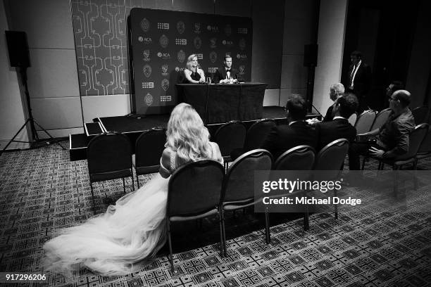 Danielle Willis watches her partner and Allan Border Medal winner Steve Smith speak with Ellyse Perry who won the Belinda Clark Award at the 2018...