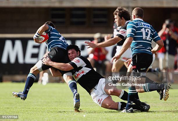 Riaan Swanepoel tackles Ryno Barnes during the Absa Currie Cup match between GWK Griquas and Sharks from GWK Park on 10 October 2009 in Kimberley,...