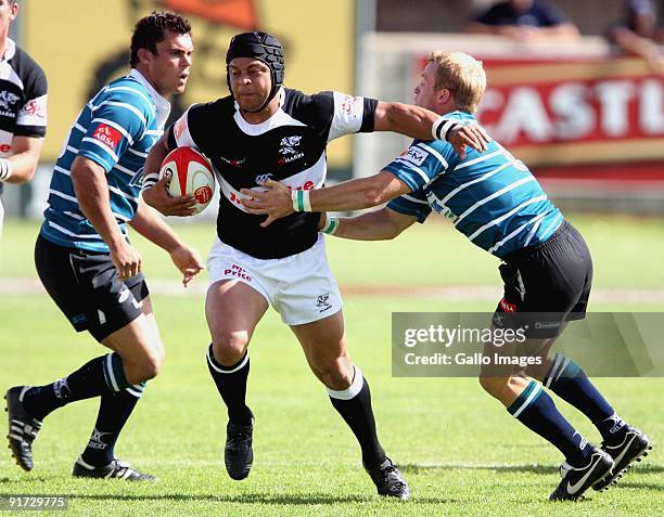 Adrian Jacobs man of the match beats Naas Olivier and Sarel Pretorius during the Absa Currie Cup match between GWK Griquas and Sharks from GWK Park...