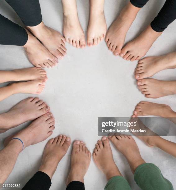 feet of people in circle together - teen girls toes stock pictures, royalty-free photos & images