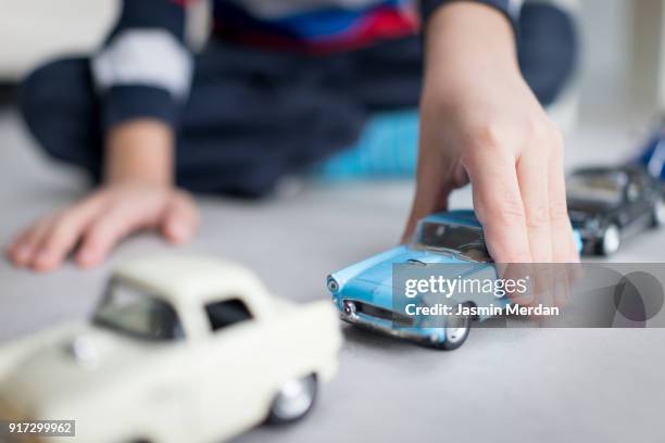 little boy playing with cars toys - boy kid playing cars stock pictures, royalty-free photos & images