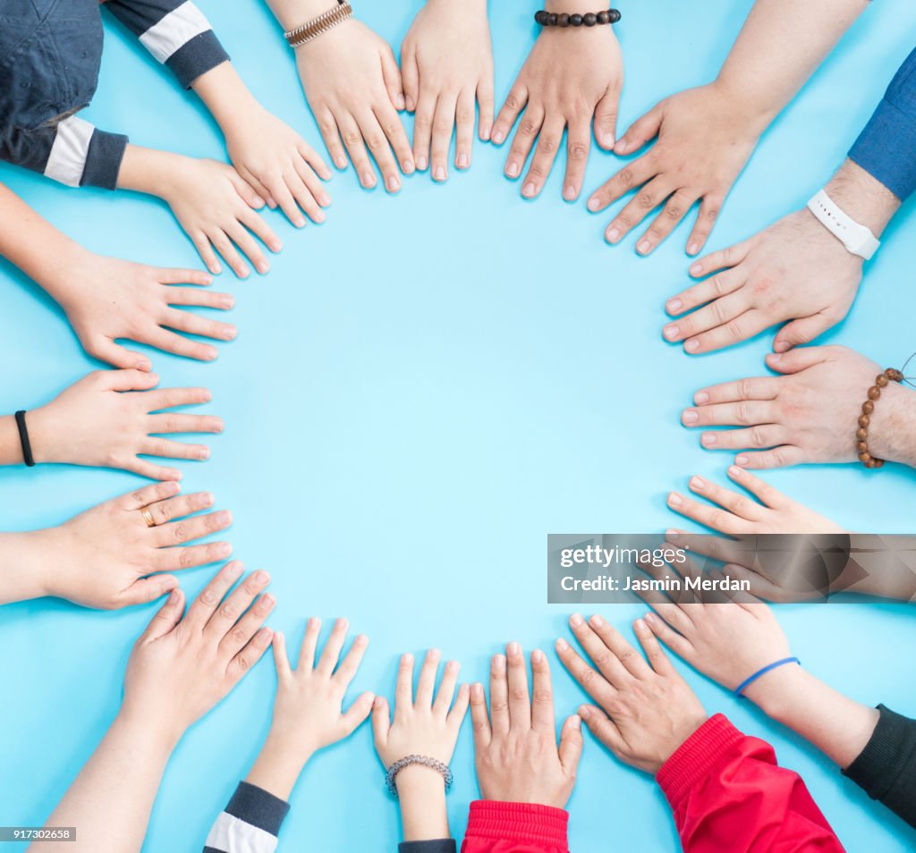Hands together in circle