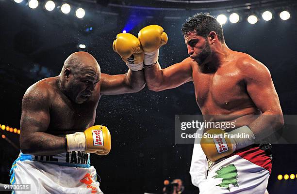 Sherman Williams of the Bahamas and Manuel Charr of the Lebanon exchange ounches during a heavyweight fight during the Universum Champions night...