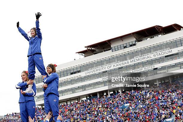 Kansas Jayhawk cheerleaders perform during the game against the Iowa State Cyclones on October 10, 2009 at Memorial Stadium in Lawrence, Kansas.