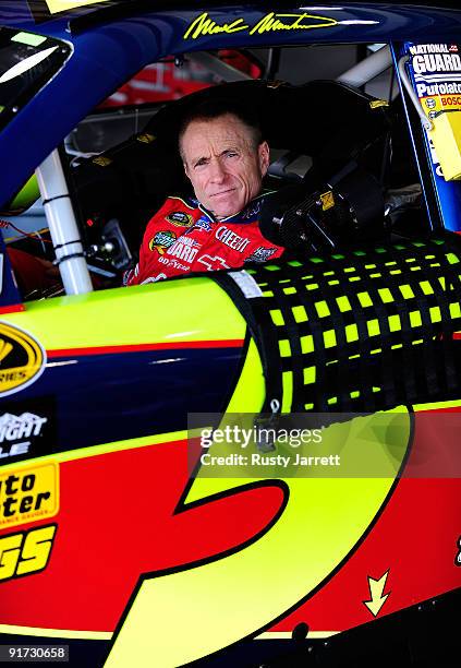 Mark Martin, driver of the Kellogg's/CARQUEST Chevrolet, waits in his car during practice for the NASCAR Sprint Cup Series Pepsi 500 at Auto Club...